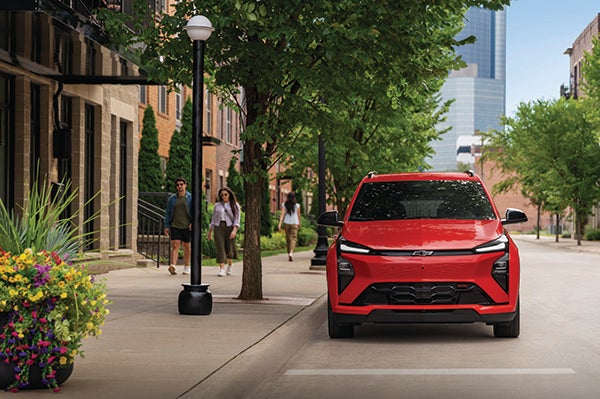 Red Chevrolet Bolt exterior on a city street